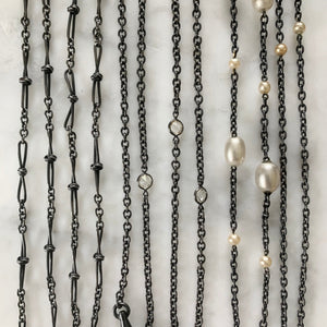 An assortment of gunmetal chains