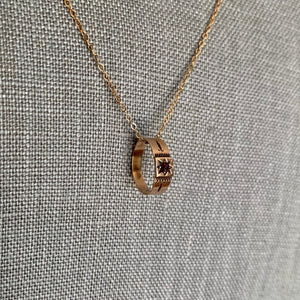 In the Victorian era, these tiny 14K rings were baby rings. They are beautiful examples of classic Victorian styling featuring genuine stones in a starburst setting. Wear them on one of our antique gold chains as a necklace or off as a pinky or midi ring. Shown on necklace