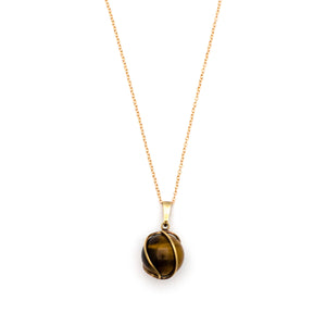 This dynamic charm is made of cymophane, more commonly known as Cat's Eye and is encased in a 8K gold setting. Cat's Eye is believed to help ward off evil and also acts as a talisman to protect against unforeseen danger. Paired with one of our new 14k gold chains, this is the ultimate good luck charm. Charm shown on chain view