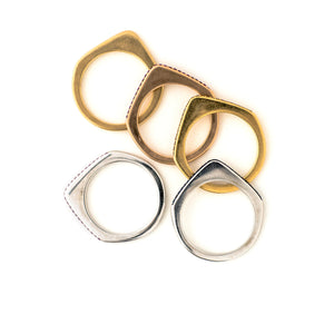These incredibly unique rings from the 1970s are made of 18K gold and feature a sleek silhouette with a point on the top. They are available either solid gold or encrusted in sapphires. These can be worn on their own, as a set or add one to your existing stack for even more drama. These are a true statement piece! Ring side view