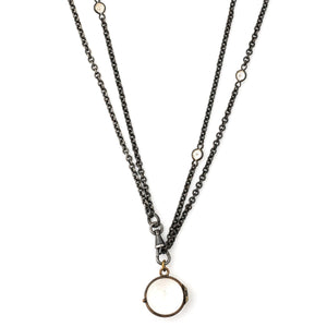 Pool of Light Antique Locket, front view. Portrait locket that holds photos and pictures, shown on antique gunmetal and glass watch chain