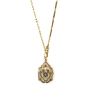 12K Rose Gold Enamel Shield Antique Locket shown on 14K gold and black enamel antique watch chain, front view