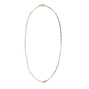 This 14k gold and black enamel bar link chain is made up of 2 watch chains which are both exquisitely etched with intricate black enamel patterns and compliment each other perfectly. Paired with one of our antique gold lockets or on its own, this chain will make a statement. Full chain view