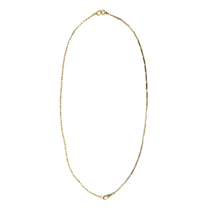 This 14k gold and black enamel bar link chain is made up of 2 watch chains which are both exquisitely etched with intricate black enamel patterns and compliment each other perfectly. Paired with one of our antique gold lockets or on its own, this chain will make a statement. Full chain view