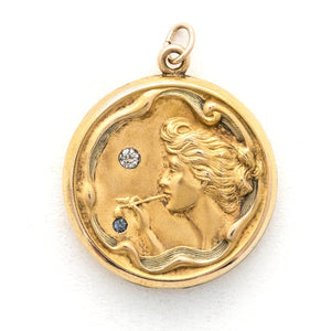 Bubble Fairy antique locket, front view, gold fill, paste stones, woman blowing bubbles, front view