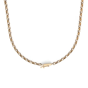 This Victorian cable chain is crafted from rosy 14K gold in a versatile 25" length, and features a barrel clasp. Paired with one of our antique gold lockets or worn on its own, this necklace will be treasured for generations to come. Close up view showing clasp