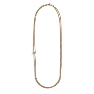 This 12K gold fill antique curb watch chain measures 25" in length doubled. It features a gold fill heart shaped slide adornment with an etched flower with an opal at its center. Doubled up, this chain is striking with a gold locket or on its own. Full chain view