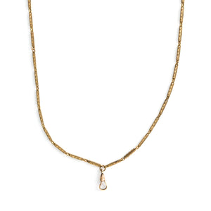 This stunning 28" gold fill bar link chain is made up of substantial bar links, each intricately etched with a zigzag design. The swivel clasp is perfect for a collection of charms or paired with one of our antique lockets. Close up view showing watch chain clasp