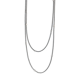 This long Victorian gunmetal chain measures 60" in length and features 18 incredibly cut glass stones. Doubled up on a spring ring clasp, it is nearly 30" in length and is unique on its own or pairs perfectly with one of our vintage lockets or pendants. Close up view showing stones