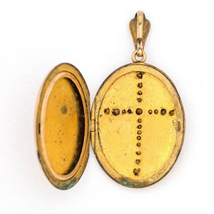 This oval locket features a white paste stone encrusted cross with a pinstripe backdrop. The letter EM are inscribed on the back. It opens to hold two photos, includes one original frame and pairs perfectly with one of our antique gold fill chains. Open locket view