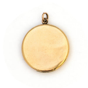 This spirited round locket features an explosive fireworks design enhanced by 21 white Victorian paste stones. It opens to hold two photos, includes both original frames and pairs perfectly with one of our antique gold fill chains. Back Locket View