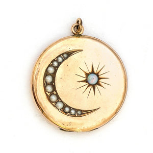 This large round locket features a pearl encrusted crescent moon and a starburst with a 4 mm opal at the center. It opens to hold two photos and pairs perfectly with one of our antique gold fill chains. Front Locket View