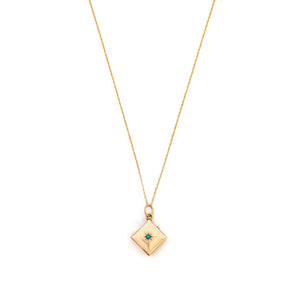 This square 10K gold locket features a simple Victorian starburst with turquoise at it's center and the letter G is inscribed on the back. It opens to hold two photos and pairs perfectly with one of our antique 14K gold chains. Front Locket View, Shown on chain