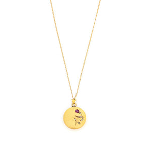 This petite 14K gold round locket features a whimsical floral design encrusted with 8 diamonds and a pear shaped ruby. It opens to hold two photos, includes one original frame and pairs perfectly with one of our antique 14K gold chains. Front Locket View, shown on chain