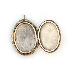 This unusual 10K gold oval locket features extremely intricate Niello technique with use of both yellow and rose gold and silver, a truly unique piece! It opens to hold two photos, includes both original frames and pairs perfectly with one of our antique 14K gold chains. Open locket view