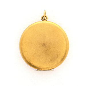 This incredibly unique gold fill locket features red and white paste stones surrounding a central starburst. This locket has two compartments: one that holds a photo, original frame included, and a second secret compartment that holds a tiny sachet. The inscribed text inside the locket tells us this design was patent pending (See photos). We've never seen anything like it! This gem pairs perfectly with one of our antique gold fill chains. Back locket view