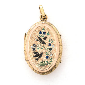 This striking oval locket features classic Victorian era symbolism with a pair of swallows surrounded by forget-me-not flowers enhanced with blue, white and green enamel throughout the design. It opens to hold two photos and pairs perfectly with one of our antique gold fill chains. Front Locket View