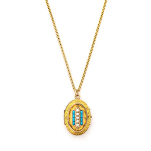 This oval locket features 5 pearls set above 8 turquoise baguettes with a zigzag pattern around the edge creating a dynamic three dimensional design. It opens to hold two photos, includes both original frames and pairs perfectly with one of our antique gold fill chains. Front Locket View, shown on chain