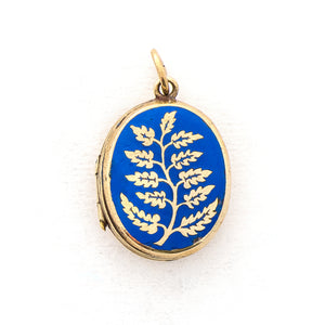 This gorgeous oval locket features periwinkle blue enamel as the backdrop to a climbing golden vine. It opens to hold two photos and pairs perfectly with one of our antique gold fill chains. , front locket view