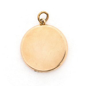 This round locket features a Maltese Cross, a symbol of protection, made up of blue, white and grey paste stones surrounded by a paste stone border. It opens to hold one photo and pairs perfectly with one of our antique gold fill chains. Back locket view