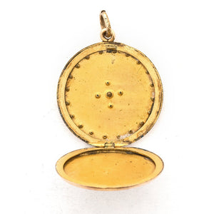 This round locket features a Maltese Cross, a symbol of protection, made up of blue, white and grey paste stones surrounded by a paste stone border. It opens to hold one photo and pairs perfectly with one of our antique gold fill chains. Open locket view
