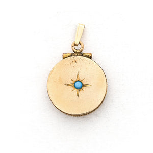 This petite circular locket features a classic Victorian starburst with a gorgeous opal at it's center. It opens to hold two photos and pairs perfectly with one of our antique gold fill chains. Front Locket View