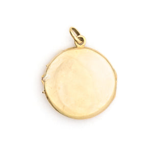 This beautifully simple 14K gold locket features a 10 point genuine diamond at its center. It opens to hold one photo, includes one original frame and pairs perfectly with one of our antique 14K gold chains. Back locket view