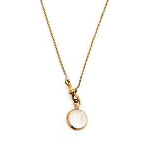 This Pool of Light locket features two halves of a rock crystal joined by a substantial gold fill frame and hinge. It opens to hold two photos that can be seen through the crystal and slightly magnified. Paired with one of our antique gold fill watch chains, this collectors piece will endure for generations to come. Locket shown on chain