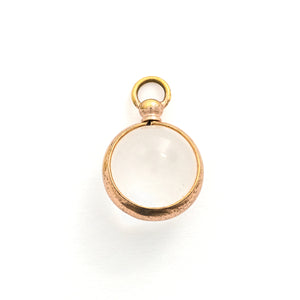 This Pool of Light locket features two halves of a rock crystal joined by a substantial gold fill frame and hinge. It opens to hold two photos that can be seen through the crystal and slightly magnified. Paired with one of our antique gold fill watch chains, this collectors piece will endure for generations to come. Front locket view
