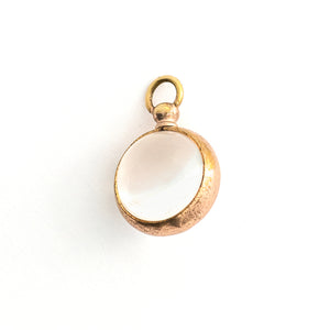 This Pool of Light locket features two halves of a rock crystal joined by a substantial gold fill frame and hinge. It opens to hold two photos that can be seen through the crystal and slightly magnified. Paired with one of our antique gold fill watch chains, this collectors piece will endure for generations to come. Back locket view