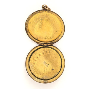 This Victorian round locket features a classic crescent moon and starburst, with a pearl encrusted crescent and jade as the center of the starburst. The letters "JO" are inscribed on the back. It opens to hold two photos and pairs perfectly with one of our antique gold fill chains. Open locket view