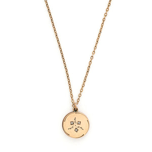 This simple round slide locket features 3 white glass stones and a minimalist thirds design. It slides opens to hold two photos and pairs perfectly with one of our antique gold fill chains. Front locket view, shown on chain