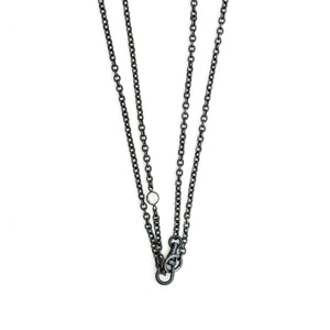 This long Victorian gunmetal chain measures 42" in length and features 5 incredibly cut glass stones. Doubled up on a swivel clasp, it is nearly 21" in length and would pair perfectly with either a vintage silver or gold locket. Close up view