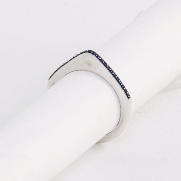 These incredibly unique rings from the 1970s are made of 18K gold and feature a sleek silhouette with a point on the top. They are available either solid gold or encrusted in sapphires. These can be worn on their own, as a set or add one to your existing stack for even more drama. These are a true statement piece! White gold and sapphire view