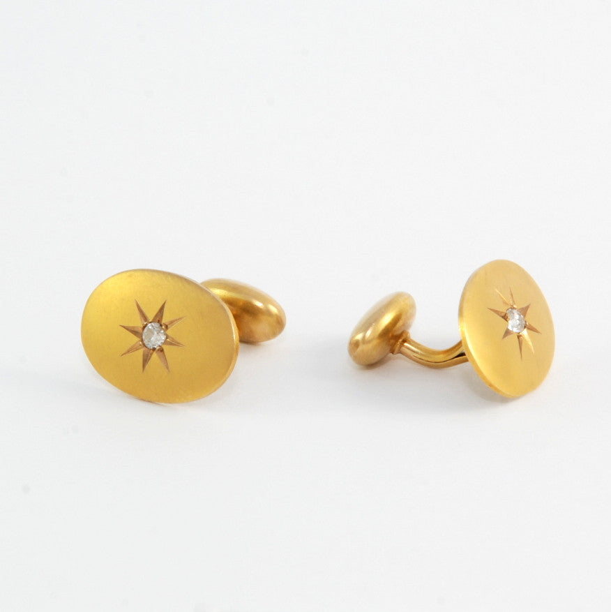 These antique solid 14k gold and old mine cut diamond star cufflinks had us at Hello. They'd make a pretty amazing gift for a dapper dad, a groom on his wedding day, or a lady who can rock shirtsleeves. Front cufflink view
