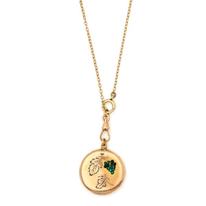 Green Grapes Antique locket, gold fill locket with green stones, opens to hold pictures and photos, front view, shown on antique gold fill watch chain