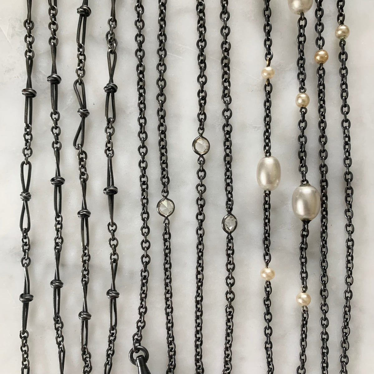 An assortment of gunmetal chains