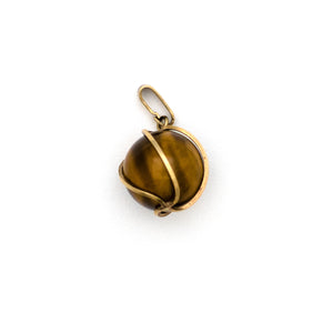 This dynamic charm is made of cymophane, more commonly known as Cat's Eye and is encased in a 8K gold setting. Cat's Eye is believed to help ward off evil and also acts as a talisman to protect against unforeseen danger. Paired with one of our new 14k gold chains, this is the ultimate good luck charm. Front charm view
