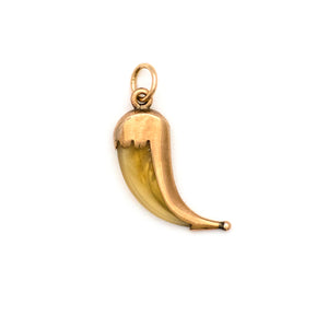 This unique horn charm features a polished 10k gold case, with a sculpted edge and a ball on the end.  Cornetto in Italian means "little horn" and is an amulet or talisman that is believed to offer protection against the evil eye when worn. Paired with one of our new 14k gold chains, this statement making charm is believed to bring luck to whomever wears it. Back charm view