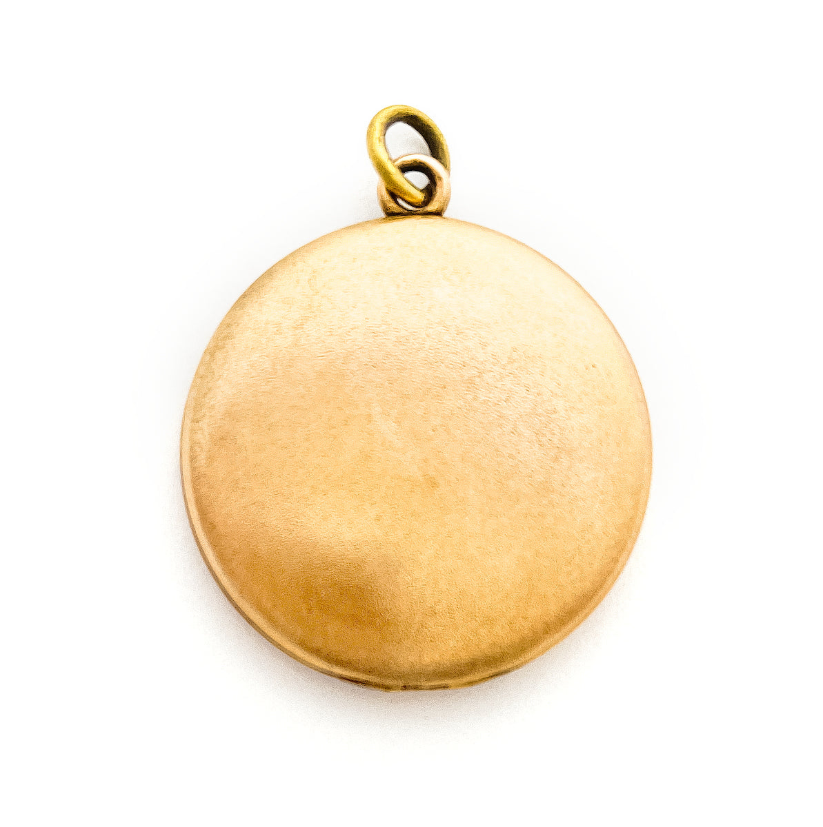 This joyous round locket features an intricate chandelier pattern with white paste stones scattered throughout the design. It opens to hold two photos, includes both original frames and pairs perfectly with one of our antique gold fill chains.  Back locket view