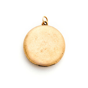This round antique locket features a simple "E" in Old English script. It opens to hold two photos and pairs perfectly with one of our antique gold fill chains.  Back locket view