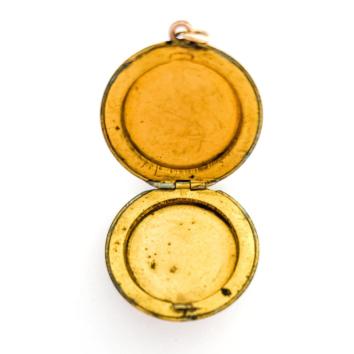 This round antique locket features a simple "E" in Old English script. It opens to hold two photos and pairs perfectly with one of our antique gold fill chains.  Open locket view