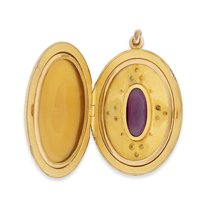 oval plum locket, locket open view, 2 original frames for pictures, beautiful condition