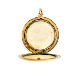This round reflective locket features a playful chandelier design with paste encrusted starbursts scattered along the bottom edge. It opens to hold two photos, includes both original frames and pairs perfectly with one of our antique gold fill chains.  Open Locket View
