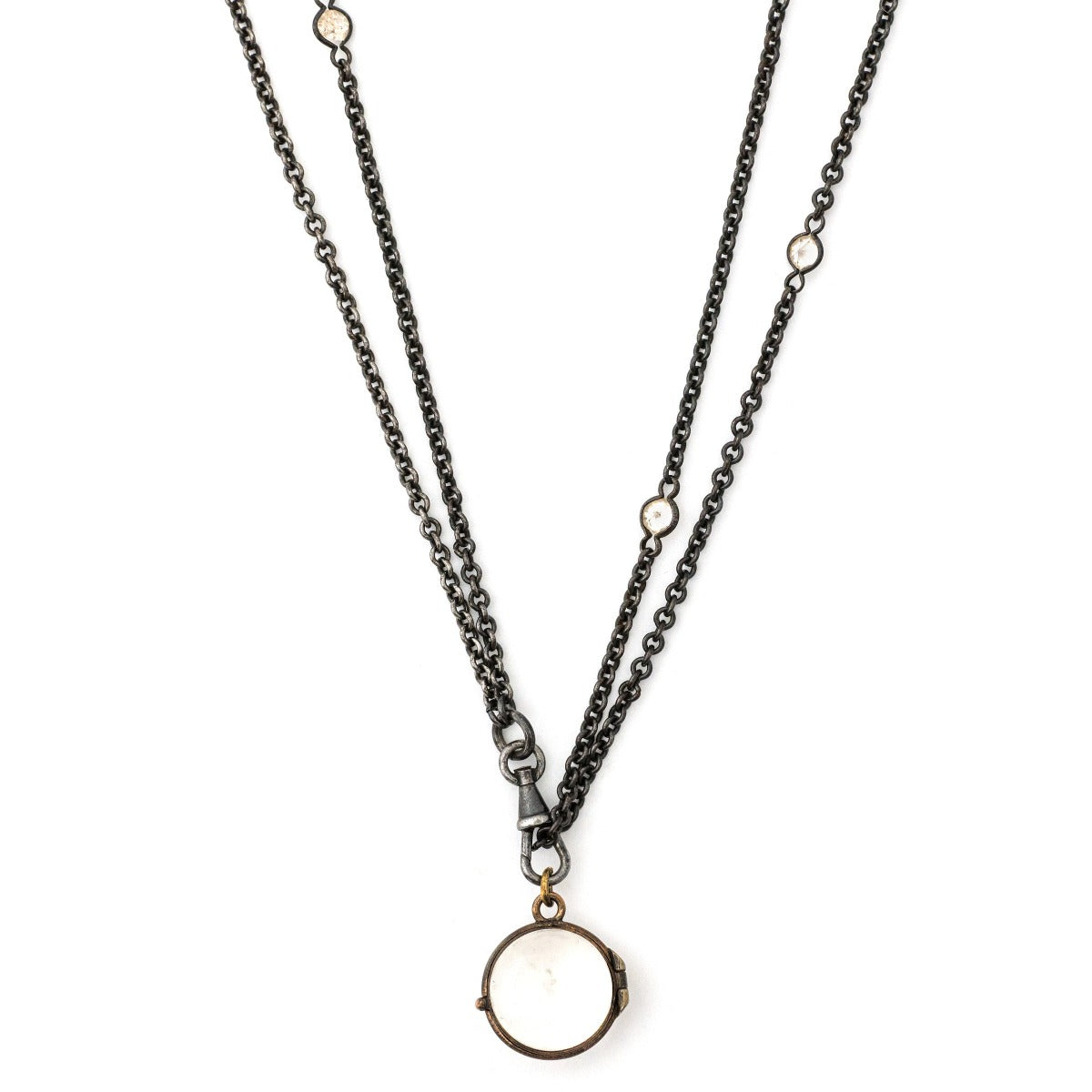 Pool of Light Antique Locket, front view. Portrait locket that holds photos and pictures, shown on antique gunmetal and glass watch chain