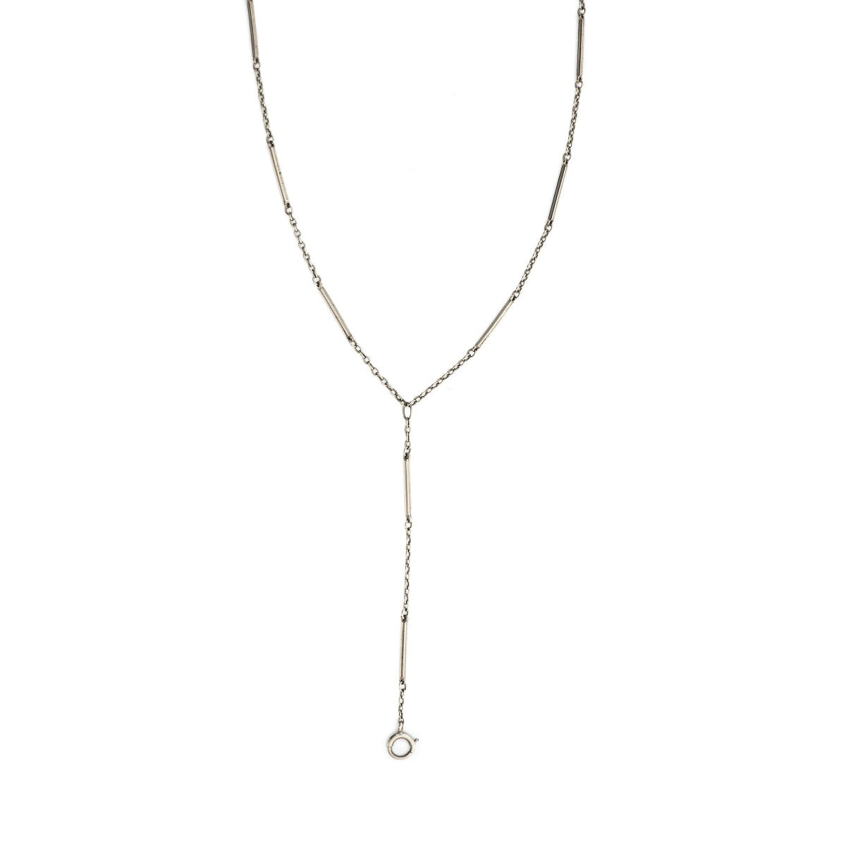 This elegant Victorian lariat chain is crafted in solid 10K white gold and with finely striped bar links alternating with a fine round cable chain. It is 28" in length with a 3.5" extension. It is crafted classic Victorian lariat chain pairs beautifully with one of our vintage lockets or charms. Close up view, showing lariat