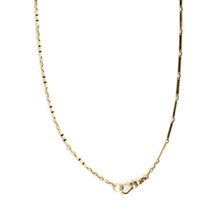 This 14k gold and black enamel bar link chain is made up of 2 watch chains which are both exquisitely etched with intricate black enamel patterns and compliment each other perfectly. Paired with one of our antique gold lockets or on its own, this chain will make a statement. Close up view showing clasp and detail