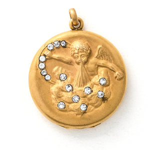 Front view of cupids breath antique locket, gold fill with victorian paste stones, cupid with wings