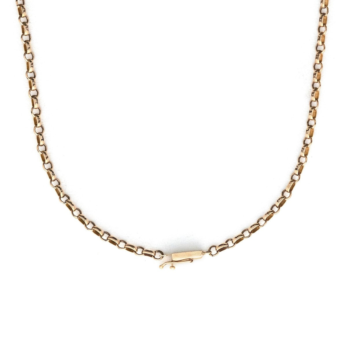 This Victorian cable chain is crafted from rosy 14K gold in a versatile 25" length, and features a barrel clasp.  Paired with one of our antique gold lockets or worn on its own, this necklace will be treasured for generations to come. Close up view showing clasp