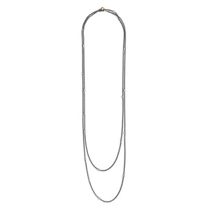 This long Victorian gunmetal chain measures 60" in length and features 18 incredibly cut glass stones. Doubled up on a spring ring clasp, it is nearly 30" in length and is unique on its own or pairs perfectly with one of our vintage lockets or pendants. Full chain view